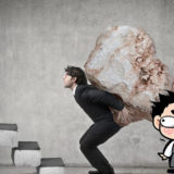 仕事のプレッシャーに押しつぶされそうな男性のイメージ